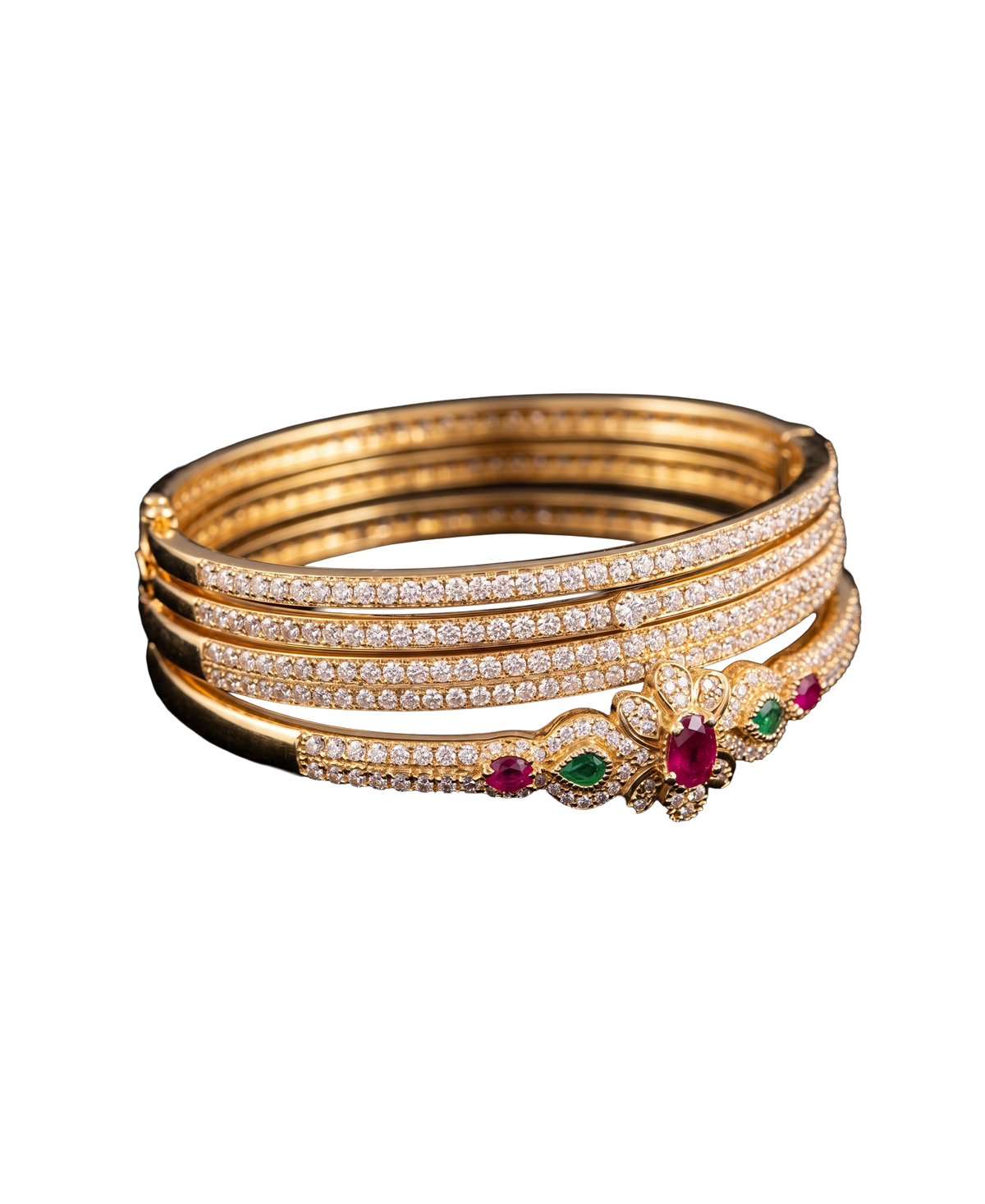 Gold-tone bangle set with brilliant stones and red and green gemstone accents