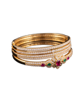 Gold-tone bangle set with brilliant stones and red and green gemstone accents