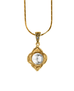 Antique-inspired gold-tone pendant with a luminous round center
