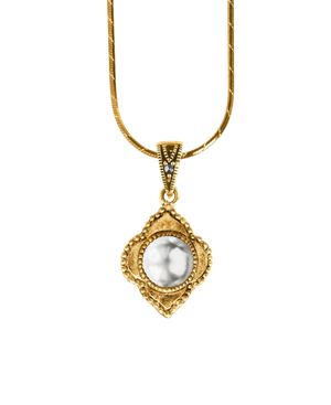 Antique-inspired gold-tone pendant with a luminous round center