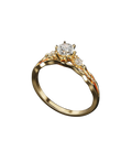 Gold-tone three-stone ring with a brilliant round center stone