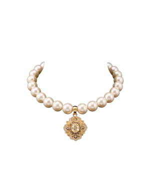 Pearl-style necklace with an ornate gold-tone medallion pendant