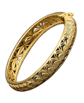 Gold-tone hinged bangle with intricate openwork vine filigree