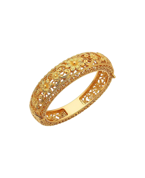 Ornate gold-tone bangle with sculpted floral and vine details