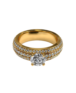 Gold-tone statement ring with a brilliant round center and sparkling stone bands