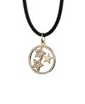 Gold-tone celestial star pendant with sparkling stones on a dark cord