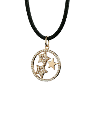 Gold-tone celestial star pendant with sparkling stones on a dark cord