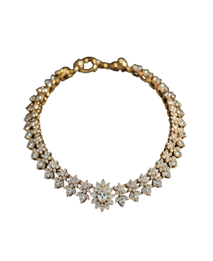 Gold-tone statement collar necklace with brilliant floral stone clusters